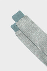 Close-up of the houndstooth pattern and hand-linked toe on Bresciani 'Attilio' socks, in a teal and ivory color.