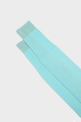 Close-up of the ribbed cuff on Bresciani Lorenzo socks, in a solid aquamarine color.