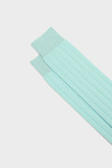 Close-up of the ribbed knit and hand-linked toe on Bresciani Massimo socks, in a solid aquamarine color.