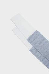 Close-up of the Lusitanian majolica inspired pattern and handmade bow on the toe of Bresciani Mattia socks, in white and sky blue.