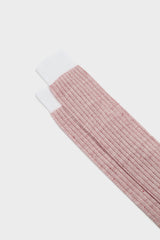 Close-up of the ribbed cuff on Bresciani Michele socks, in a red and white melange texture.