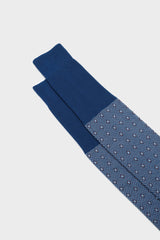 Close-up of the geometric micro-pattern and cuff on Bresciani Nicola socks, in a ocean color.