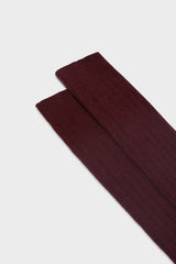 Close-up of the ribbed knit and fine texture of Bresciani 'Campidoglio' socks, in a solid burgundy color.