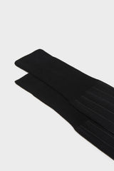 Close-up of the pinstripes and cuff on Bresciani Leone socks, in a solid black color.