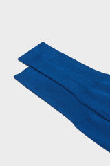 Close-up of the ribbed cuff on Bresciani Lorenzo socks, in a solid ocean color.