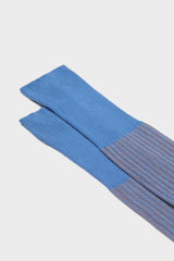 Close-up of the fine ribbed texture on the cuff of Bresciani Mario socks, in a avio orange color.