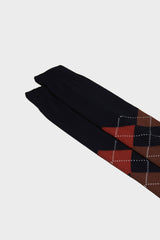 Close-up of the hand-linked toe and argyle intarsia pattern on Bresciani 'Luca' socks, showing the colors blue rust brown