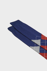 Close-up of the hand-linked toe and argyle intarsia pattern on Bresciani 'Luca' socks, showing the colors ink, pewter, clay, and white.