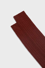 Close-up of the ribbed knit and hand-linked toe on Bresciani 'Lupo' socks, in a solid burnt color.