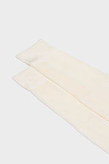 Close-up of the high cuff on Bresciani Celio socks, highlighting the single rib texture in a solid white color.