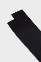 Close-up of the ribbed knit and hand-linked toe on Bresciani Valerio socks, in a solid black color.