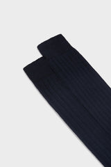 Close-up of the ribbed knit and hand-linked toe on Bresciani Valerio socks, in a solid navy color.