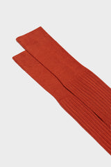 Close-up of the ribbed cuff on Bresciani Cesare socks, highlighting the high cuff and solid dark orange color.