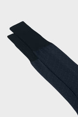 Close-up of the pindots pattern on the cuff of Bresciani Fabio socks, in a navy blue color.