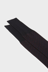 Close-up of the pindots pattern on the cuff of Bresciani Fabio socks, in a navy red color.