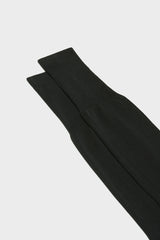Close-up of the ribbed cuff on Bresciani Lorenzo socks, in a solid black color.