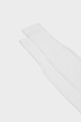 Close-up of the ribbed cuff on Bresciani Lorenzo socks, in a solid white color.