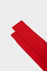Close-up of the ribbed knit and hand-linked toe on Bresciani 'Lupo' socks, in a solid red color.