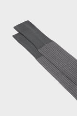 Close-up of the fine ribbed texture on the cuff of Bresciani Mario socks, in a medium grey color.