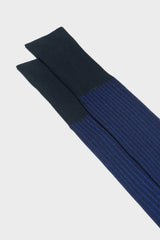 Close-up of the fine ribbed texture on the cuff of Bresciani Mario socks, in a navy blue color.