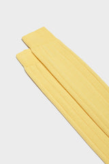 Close-up of the ribbed knit and hand-linked toe on Bresciani Massimo socks, in a solid butter color.