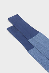Close-up of the herringbone pattern and the high cuff on Bresciani Giulio socks, in jeans sea blue color .