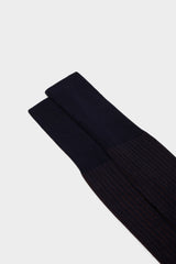 Close-up of the fine ribbed texture on the cuff of Bresciani Mario socks, in a blue brown color.